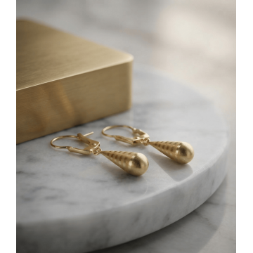 ARETES PENDULO EN ORO 18K...